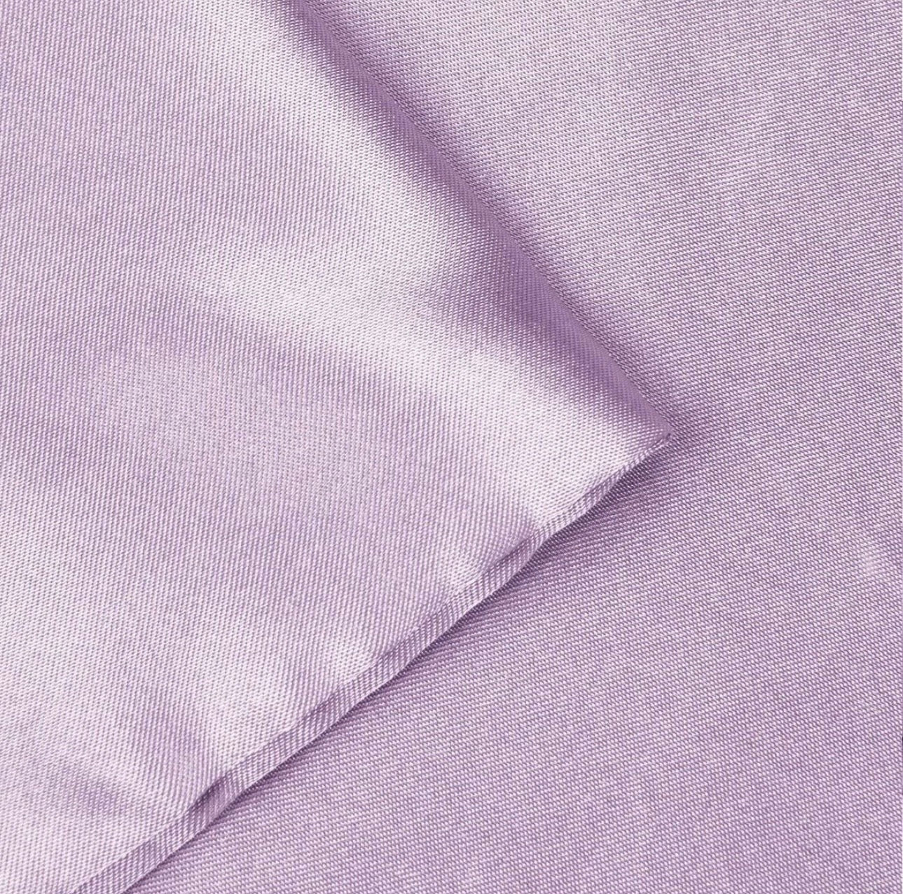 Close-up of light purple fabric with a subtle pattern