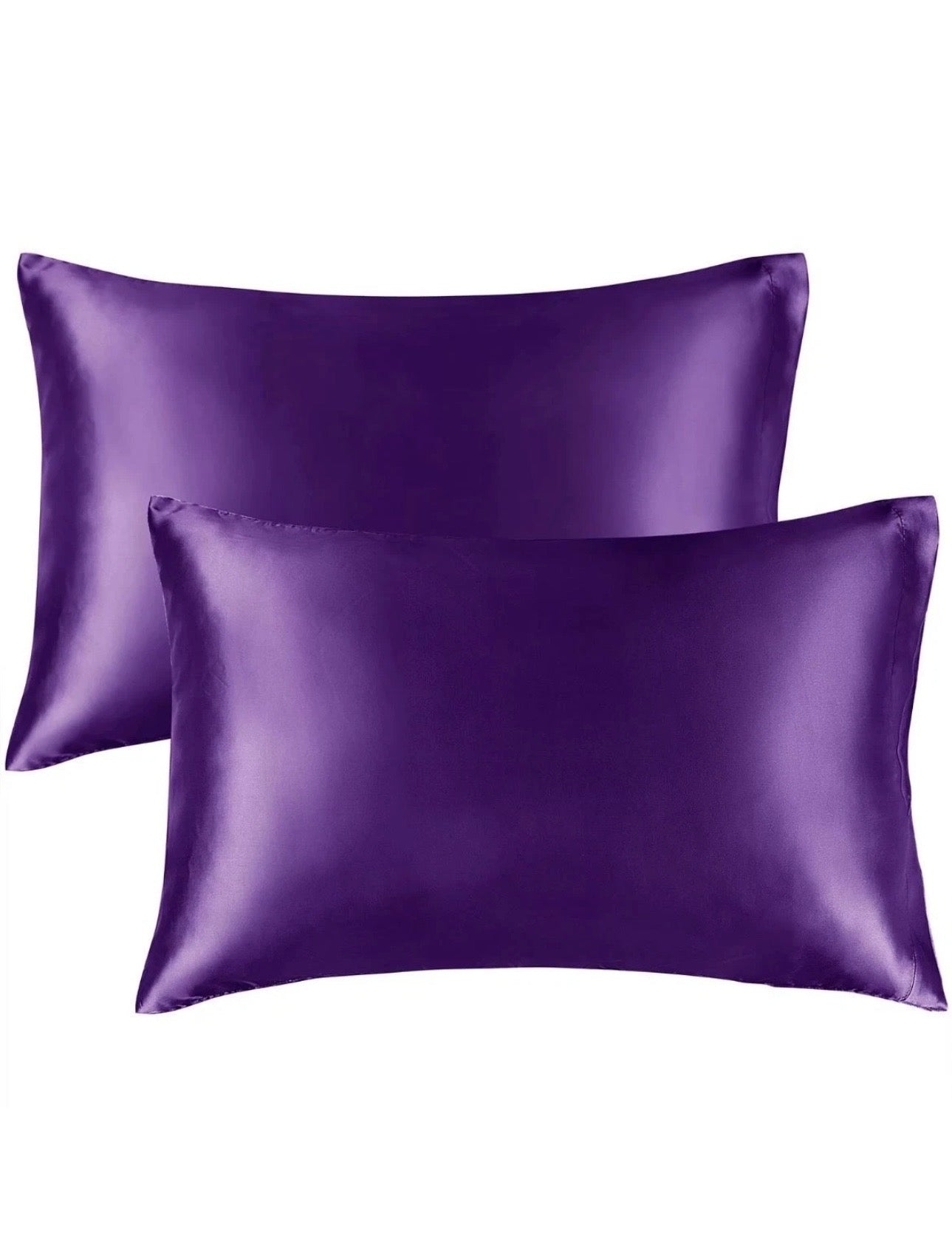 Two purple satin pillowcases on a white background