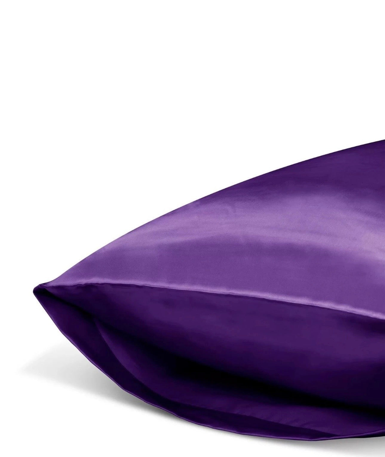 Close-up of a purple satin pillow on a white background